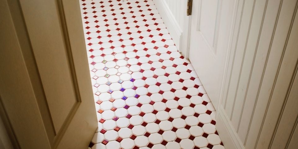 The Floor of a Bathroom Featuring a Penny Tile Design