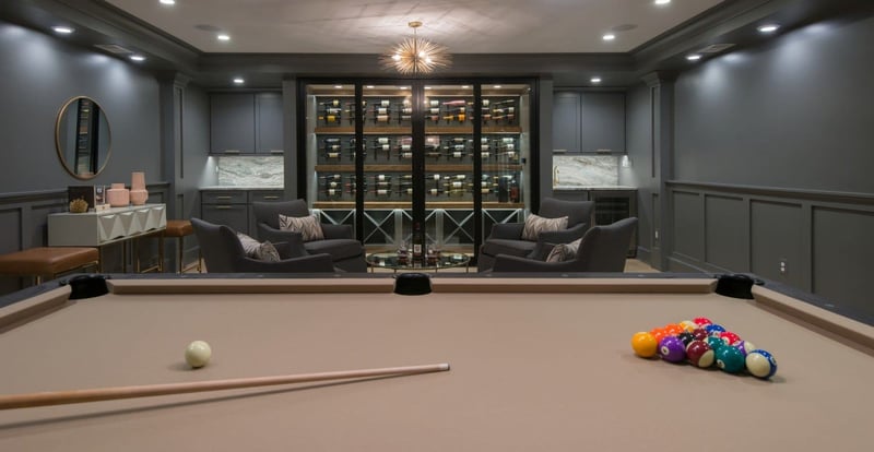 Walk In Wine Cooler Turns Basement Remodel into Classy and Glamorous Space | Denny + Gardner Basement Remodeling Services