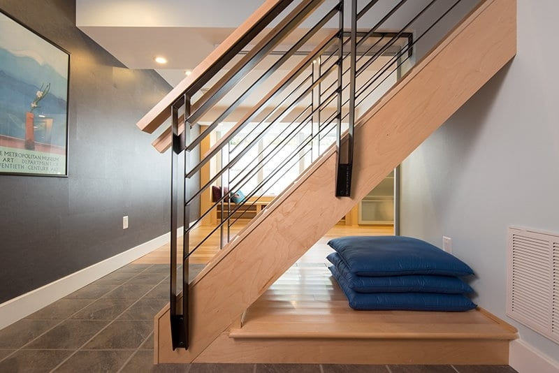 Modern Stairs with Railing into Home Gym Basement | Denny + Gardner Basement Remodeling Services