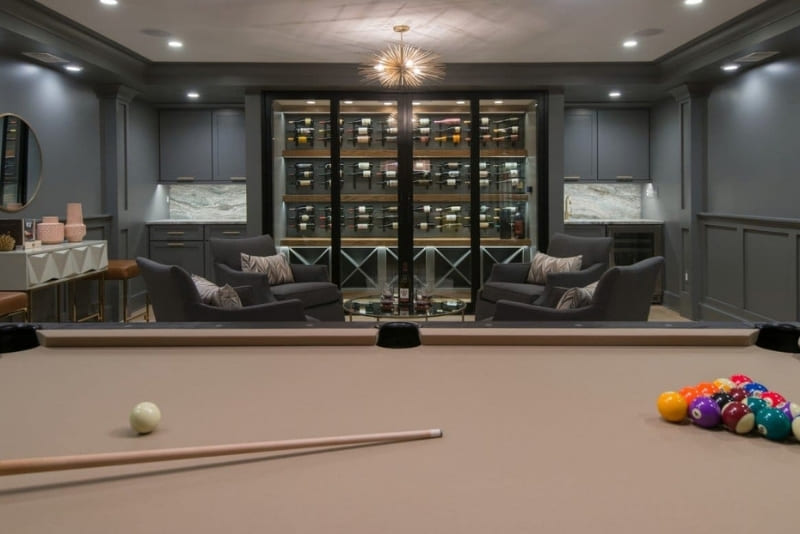 Walk In Wine Cooler Turns Basement Remodel into Classy and Glamorous Space | Denny + Gardner Basement Remodeling Services