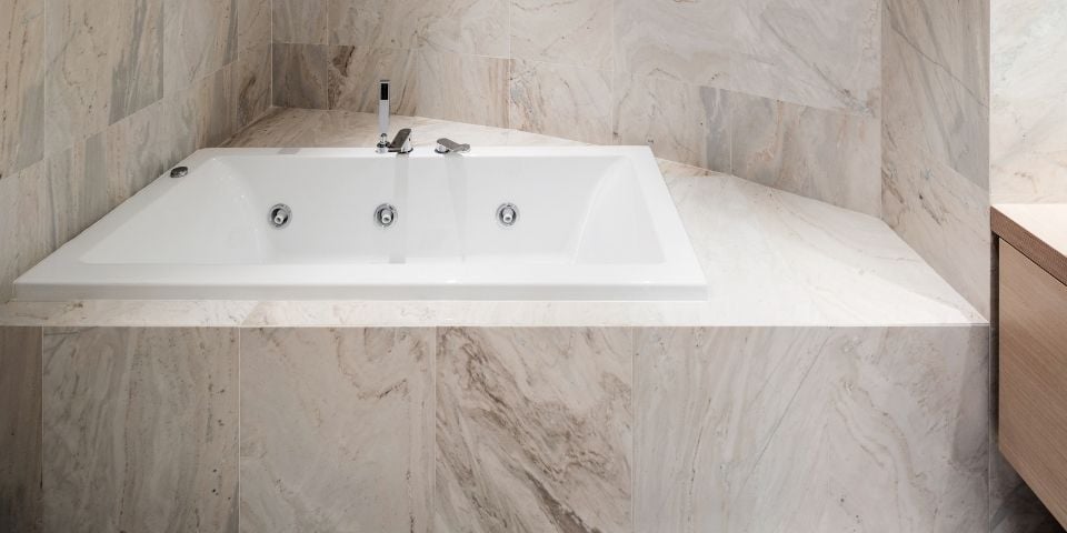 marble accented jacuzzi tub in master bath suite