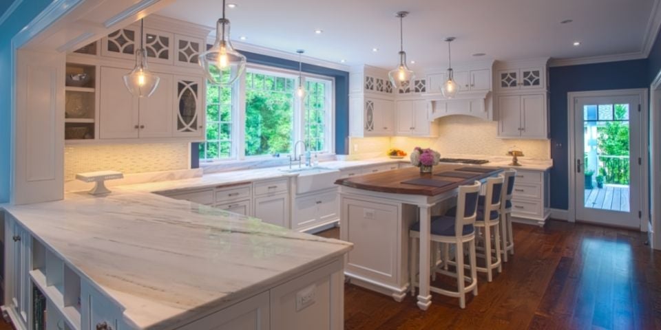 modern blue and white kitchen large windows looking outside