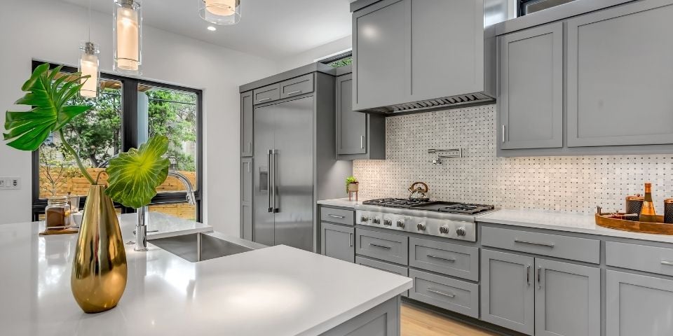 modern gray and white kitchen with shaker style cabinets