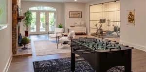 Basement remodel with gym, game room, and walkout french doors