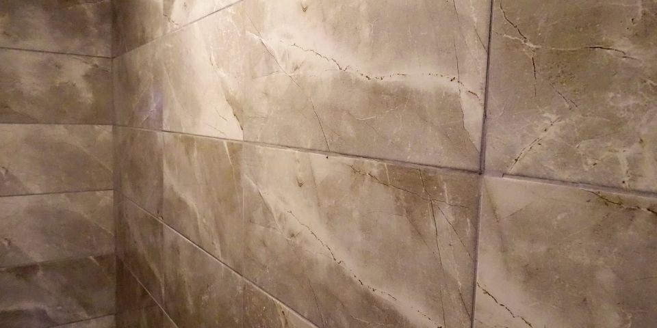 brown ceramic tile bathroom wall