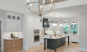 Kitchen beneath balcony overlooking great room