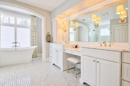 Bathroom Remodeling Services Modern Bathroom Tile Flooring Freestanding Tub and Custom Cabinetry Vanity | Denny + Gardner Design-Build Remodelers