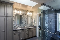 Bathroom Remodeling Services Tile Backsplash Accent Wall with Custom Vanity Sinks and Walk In Glass Shower | Denny + Gardner Design-Build Remodelers