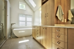 Bathroom Remodeling Services Modern Bathroom Design with Freestanding Tub and Wood Cabinetry | Denny + Gardner Design-Build Remodelers