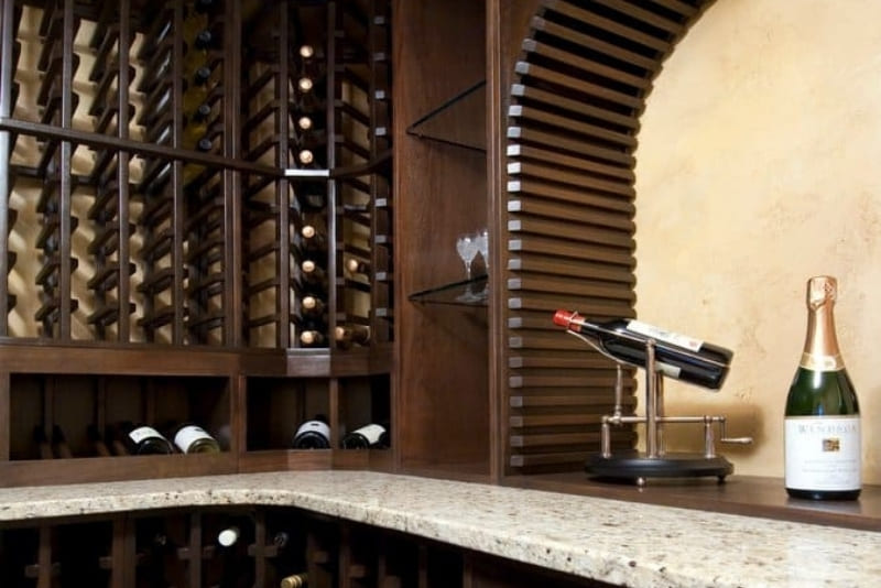 Basement Remodel Project Turns Basement into Wine Cellar with Custom Made Wine Racks for Beautiful Display | Denny + Gardner Basement Remodeling Services