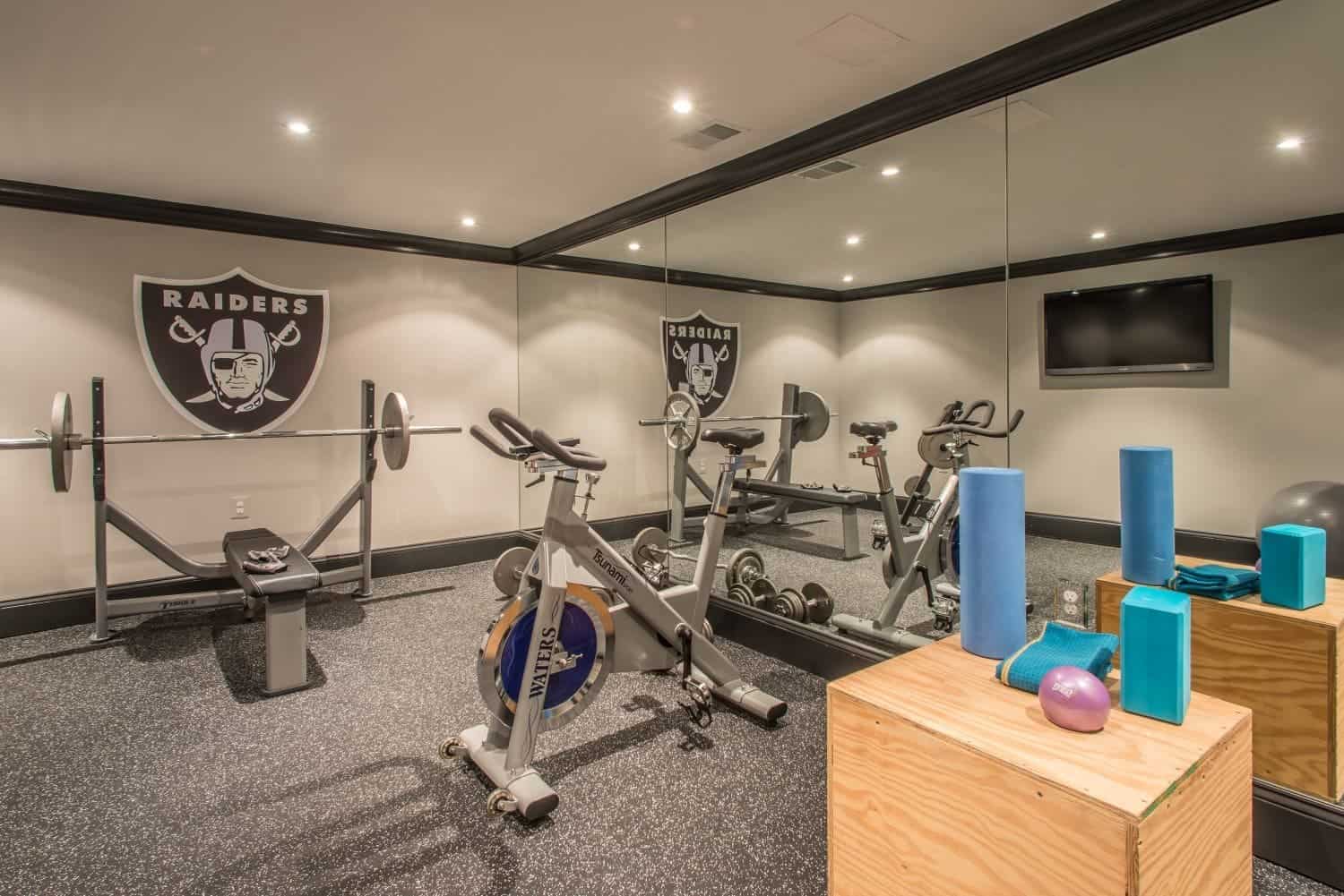Exercise Room in Basement Remodel Project with Floor to Ceiling Mirrors _ Denny + Gardner Basement Remodeling Services small