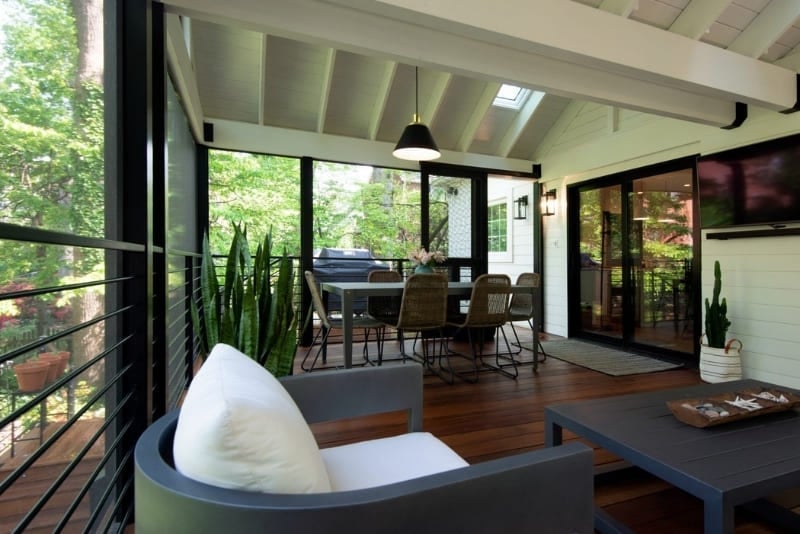 Large Enclosed Outdoor Living Area Off of Home with Cathedral Ceiling and Modern Pendant Lighting with Modern Black Framed Window Features | Denny + Gardner Outdoor Living Space Services