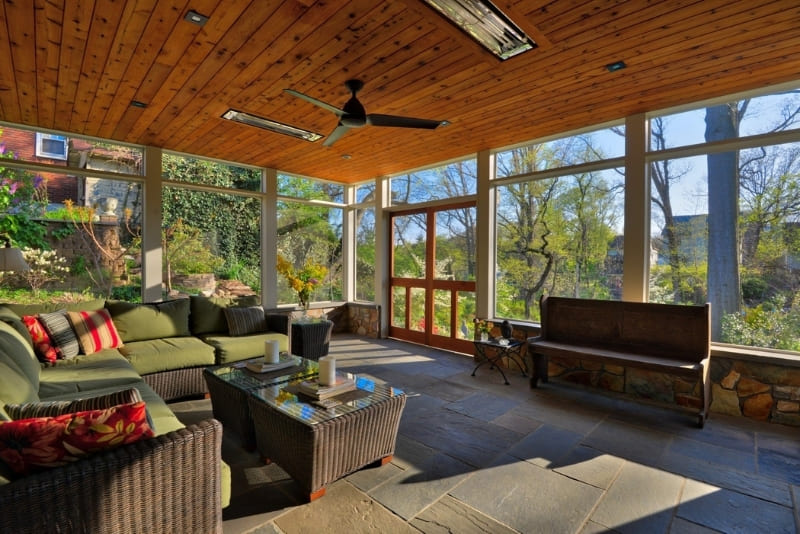 Large Enclosed Sunroom with Natural Light and Built In Fireplace with Beautiful Hardwood Ceiling | Denny + Gardner Outdoor Living Space Services