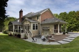 Exterior Home Addition on Beautiful Brick Home with Patio - Home Addition Services | Denny + Gardner